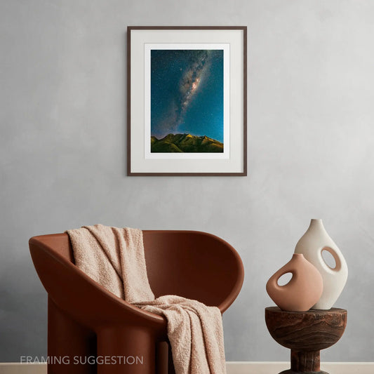 Milky Way Over the Outeniquas by Chris Daly, South African astrophotography print showing the Milky Way above the Outeniqua Mountains, displayed framed in a contemporary interior.