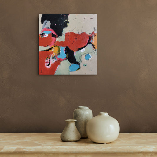 An abstract painting titled Pigments by Karen Hammat displayed on a warm brown wall above a console with neutral ceramic vessels.