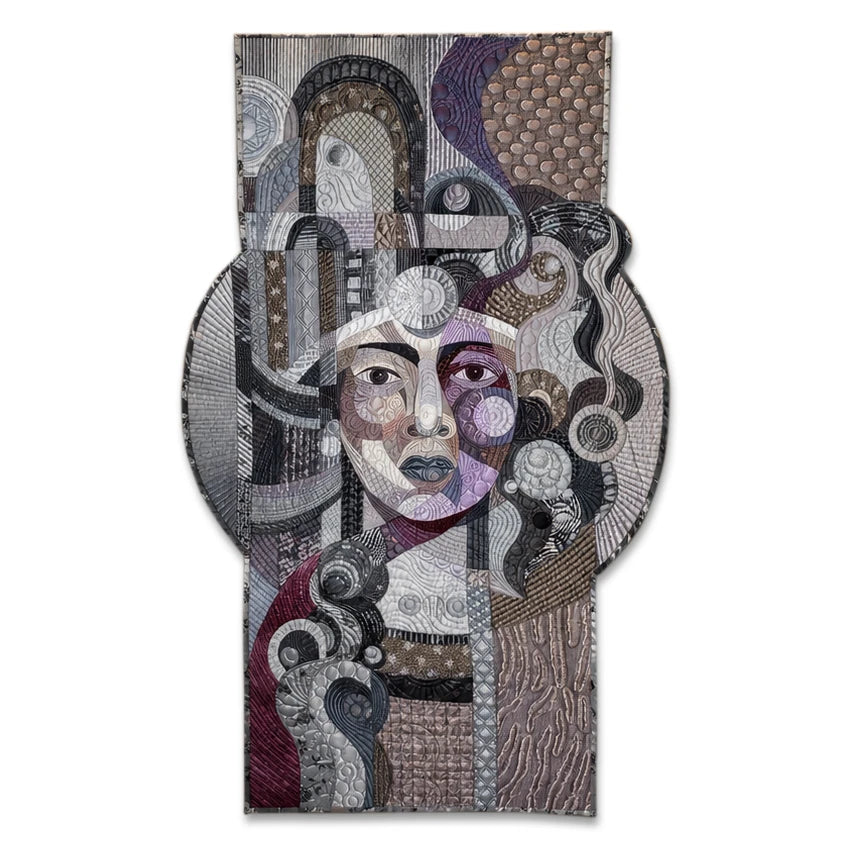 Amethyst Glow on Silver by Galla Grotto, a sculptural textile portrait created from layered fabrics, intricate stitching and quilted forms.