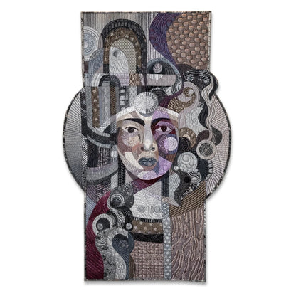 Amethyst Glow on Silver by Galla Grotto, a sculptural textile portrait created from layered fabrics, intricate stitching and quilted forms.
