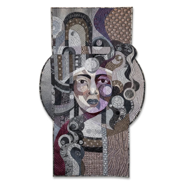 Amethyst Glow on Silver by Galla Grotto, a sculptural textile portrait created from layered fabrics, intricate stitching and quilted forms.