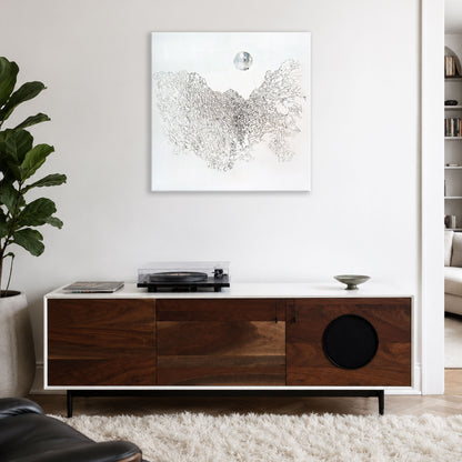 Hein Botha’s black ink drawing on canvas displayed above a wooden sideboard in a contemporary white interior.