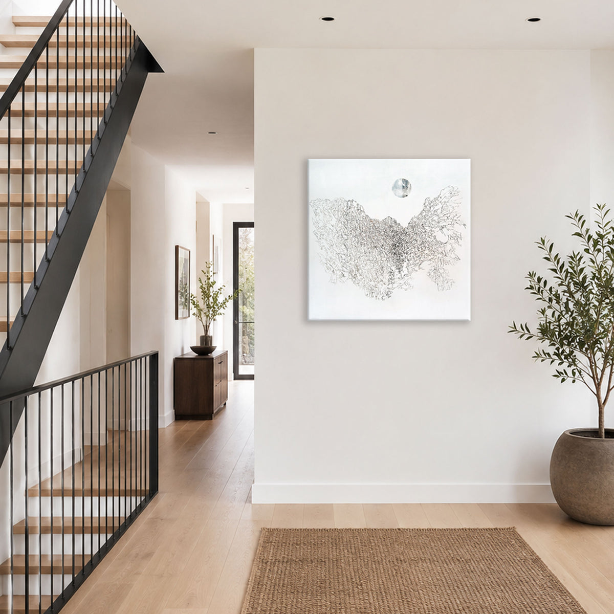 Swartberg Unfinished Symphony 2 by Hein Botha, a black ink drawing on canvas, displayed on a white wall in a contemporary interior beside a staircase.