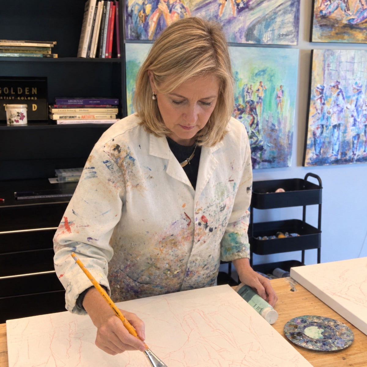 South African painter Grady T Zeeman in her studio painting.