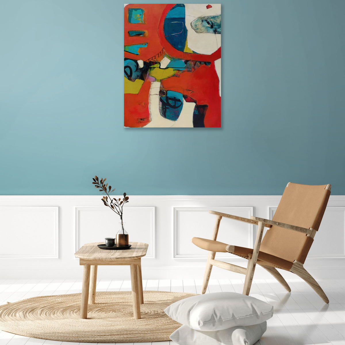 While Rome Burns by Karen Hammat displayed on a blue wall above white panelling in a contemporary interior with a timber chair.