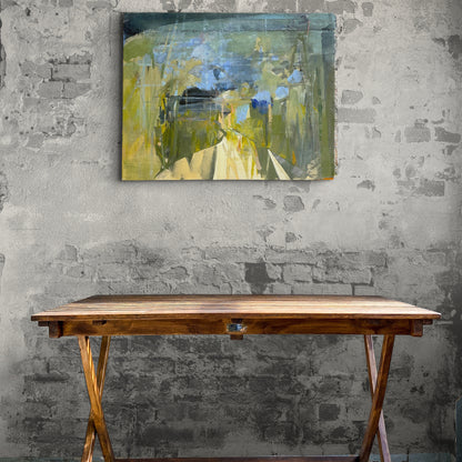 Game On by Linda McCann, an original abstract mixed-media artwork featuring layered greens, blues and yellows, displayed above a rustic wooden table against a textured plaster wall.