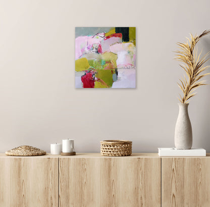 Of Morning And Mist by Karen Hammat displayed on a pale neutral wall above a light wood sideboard with ceramics and dried foliage.