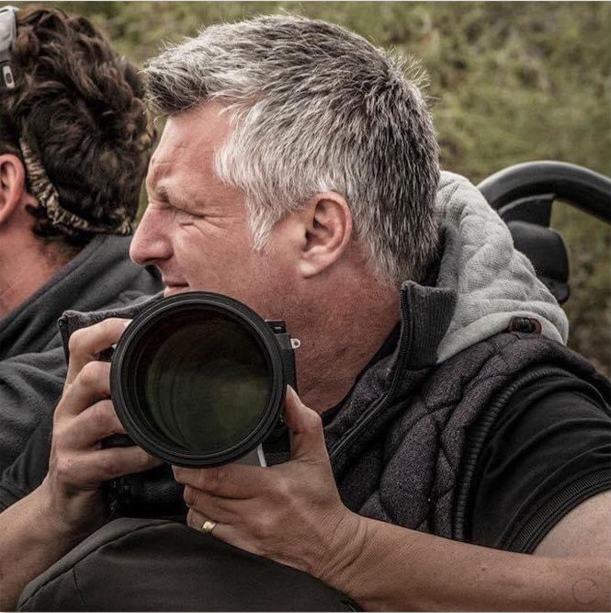 Wildlife photographer Peter Delaney with his camera while on safari in Africa.