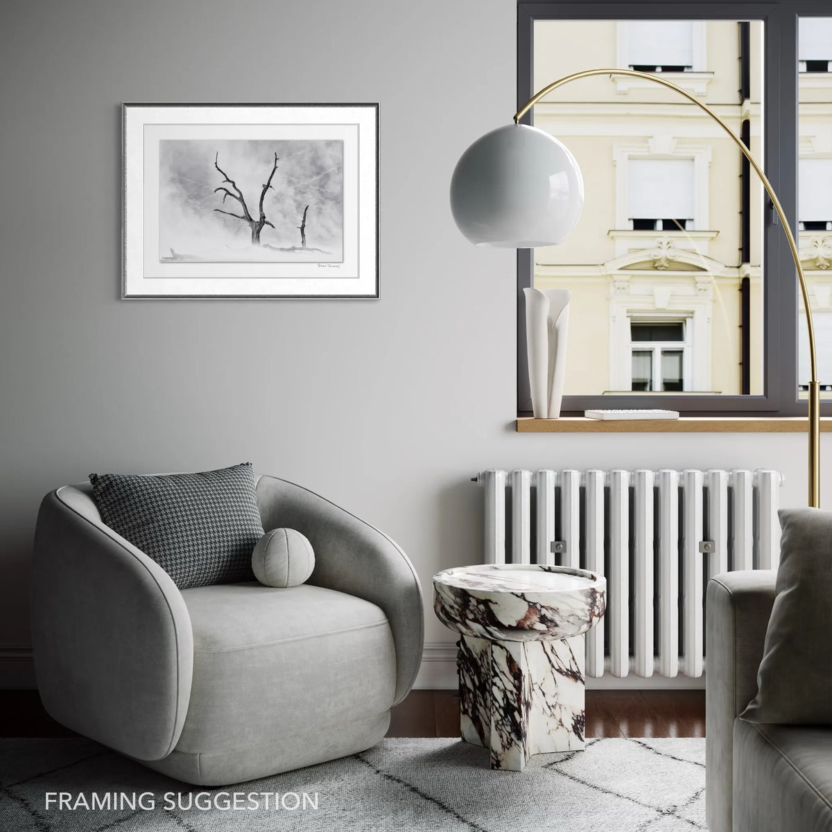 Framed black and white Deadvlei landscape photograph by Peter Delaney displayed in a contemporary grey interior.