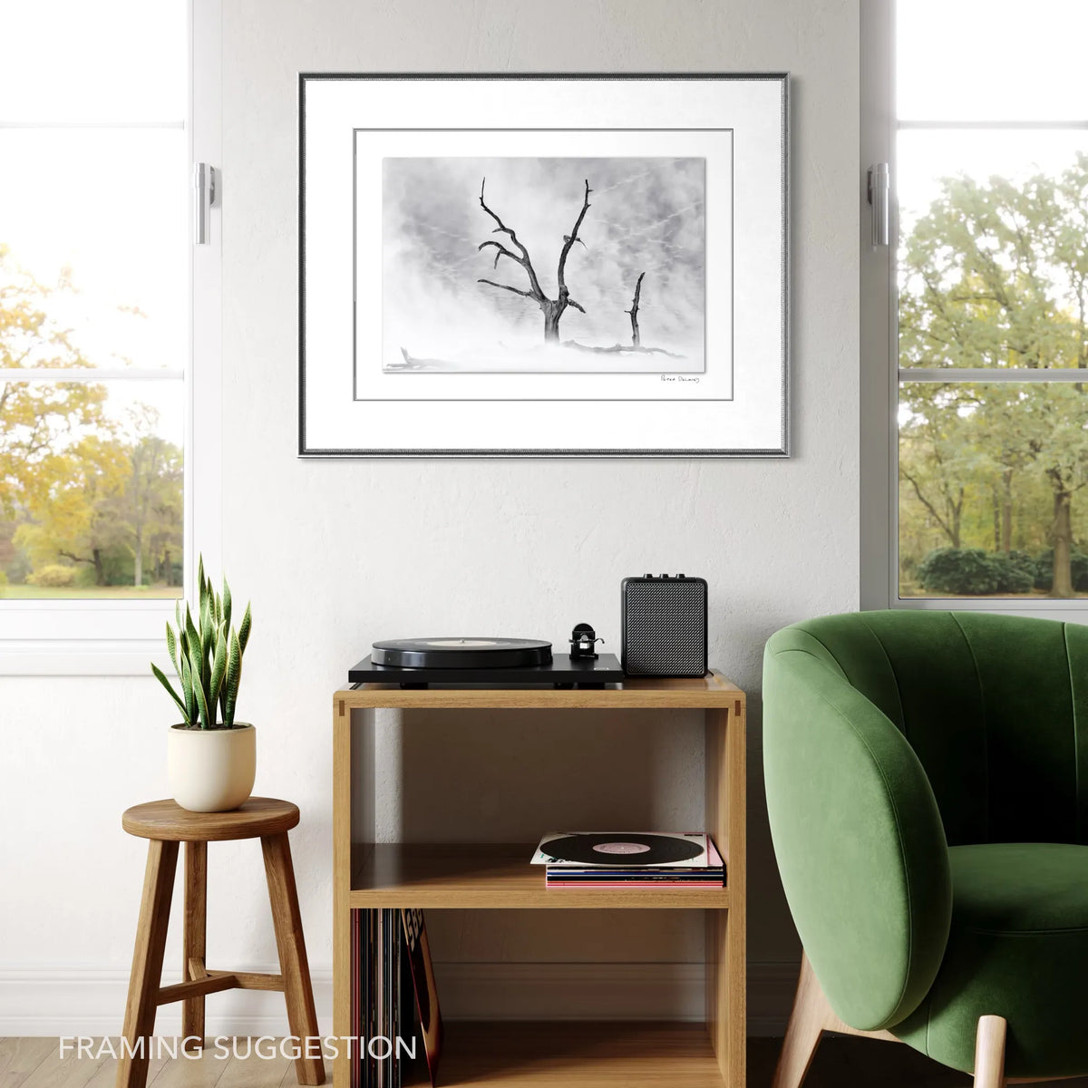 Framed Deadvlei fine art photograph by Peter Delaney displayed above a record player in a modern interior.
