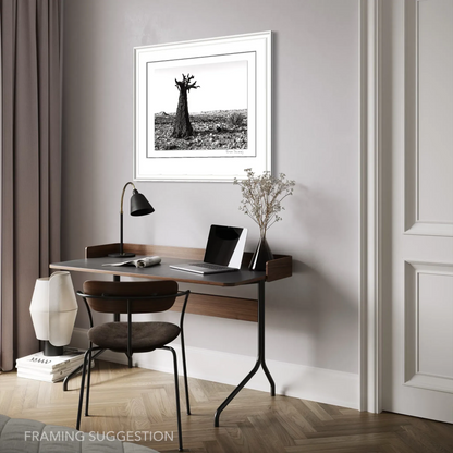 Peter Delaney’s Kuchiki no Tamashii, a black and white South African landscape photograph, framed above a desk in a contemporary interior.