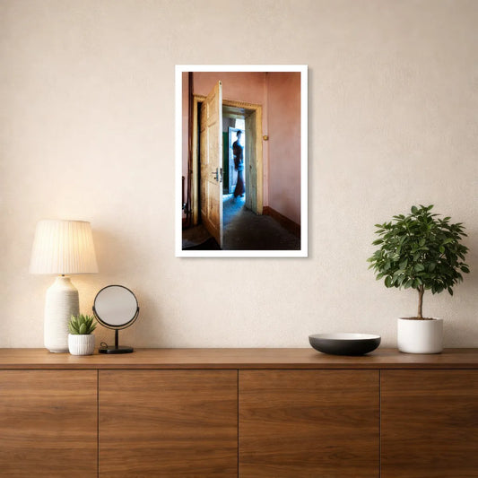 The Crossing by Robyn Daly, medium-size photographic print with a white border, displayed above a wooden sideboard.